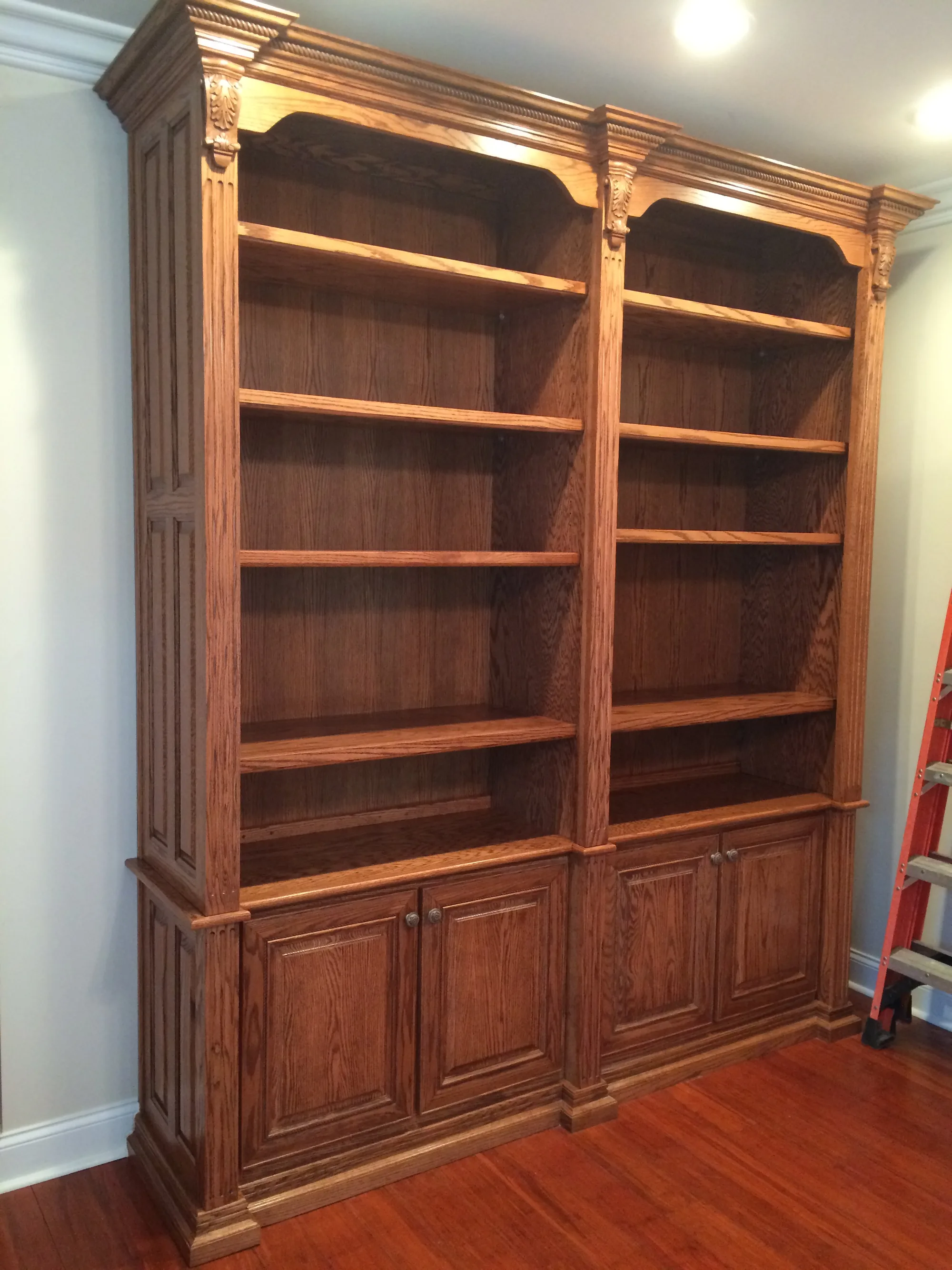 Custom built-in bookshelf with adjustable shelves by Sims Custom Woodwork.