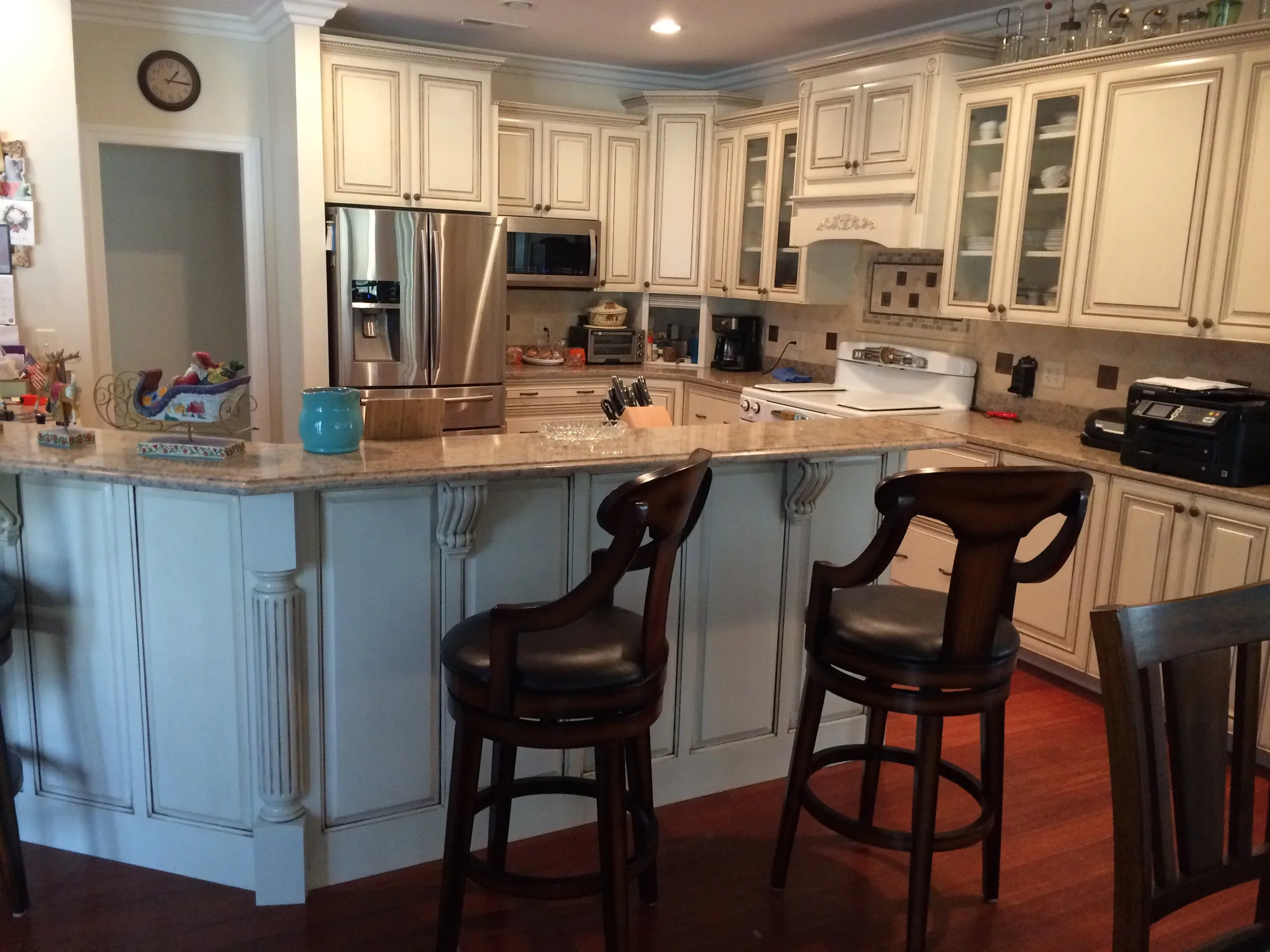 Custom kitchen island with storage drawers built by Sims Custom Woodwork.