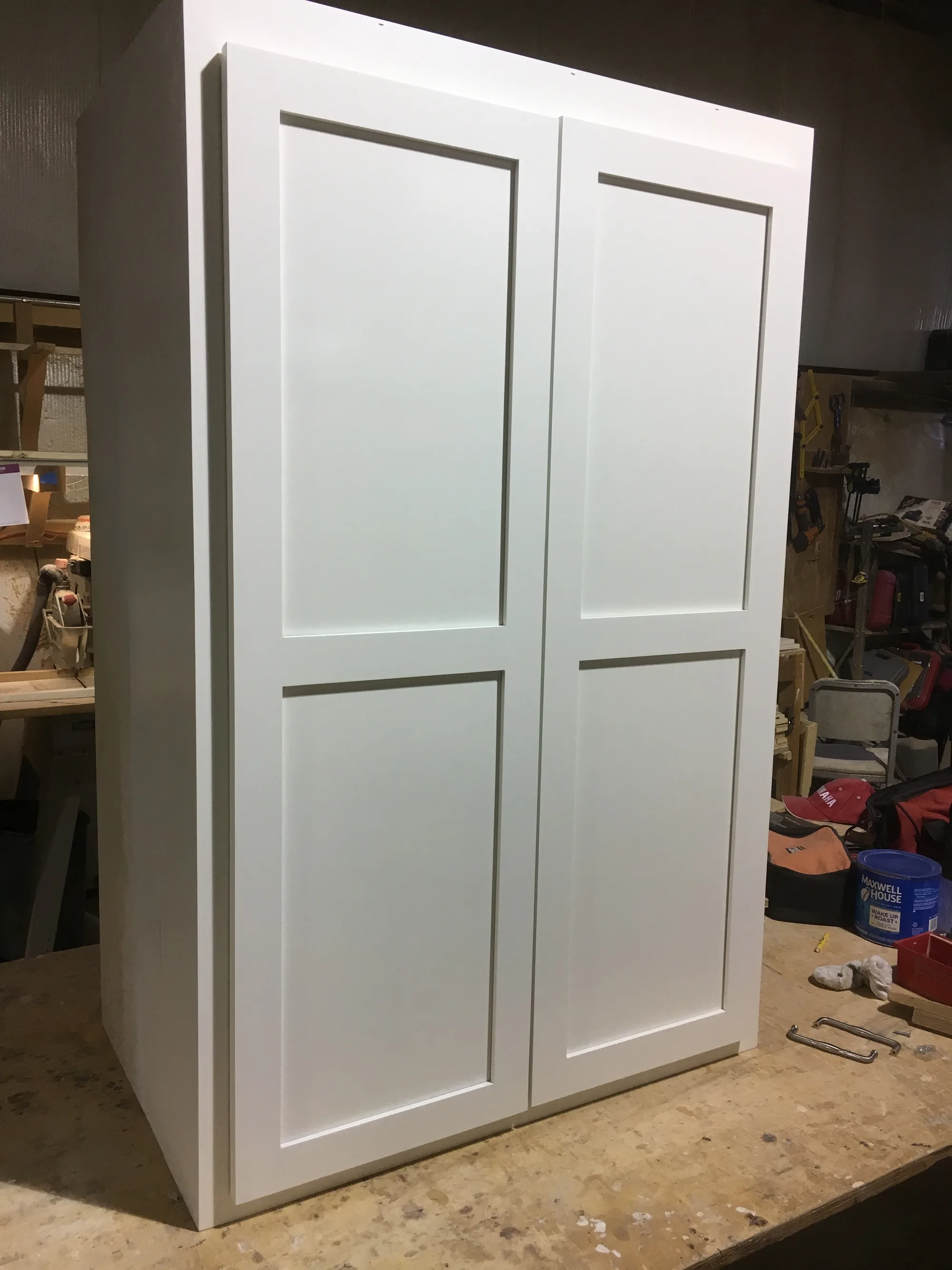 Pantry cabinet doors with concealed hinges and overlay construction.